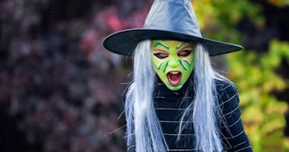 Girl in witch makeup and costume — Halloween makeup ideas for kids.