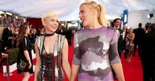 Actors Michelle Williams (L) and Busy Philipps