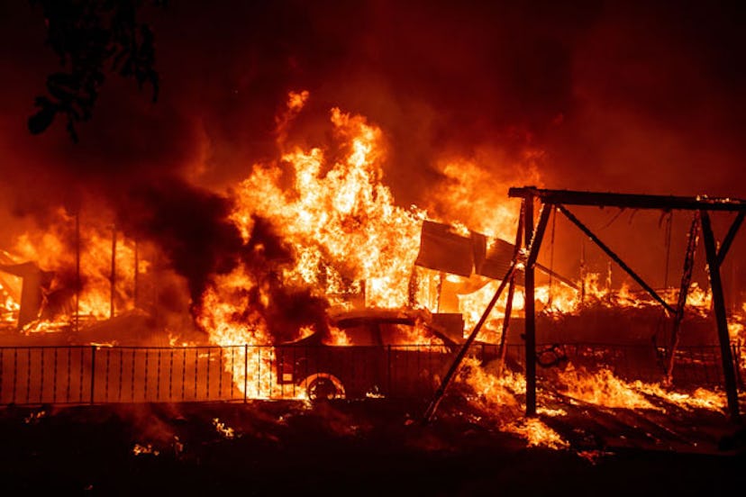 A home burns during the Bear fire, part of the North Lightning Complex fires in the Berry Creek area...