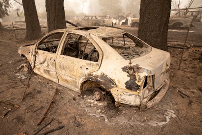 Flames from the Beachie Creek Fire melted the aluminum rims on a car near the destroyed Oregon Depar...