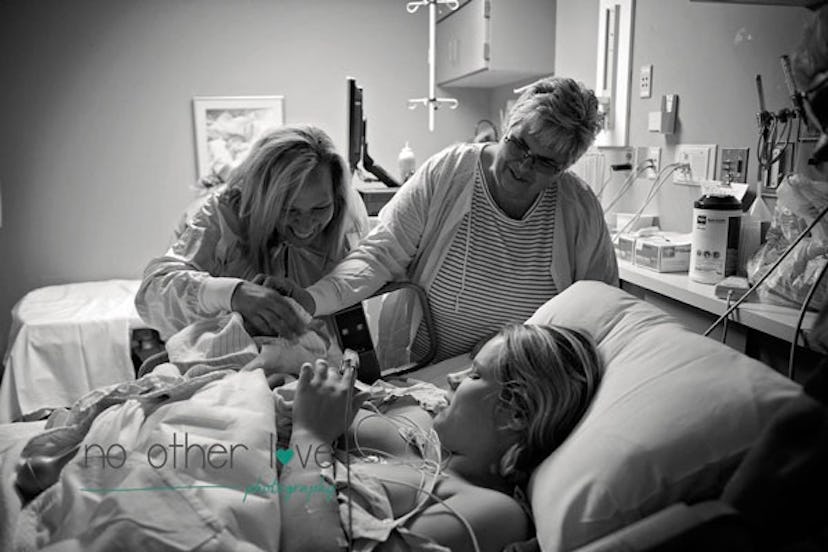 Grandmother's watching their grandchild's birth in the hospital.