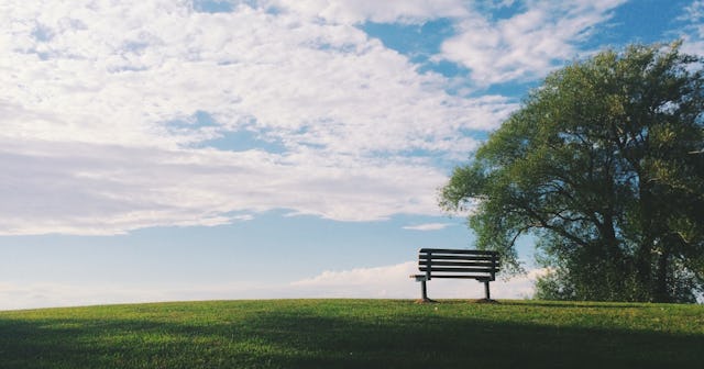 condolence messages, empty bench on a hill