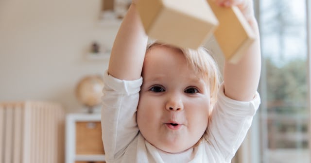 solitary play, baby playing with blocks