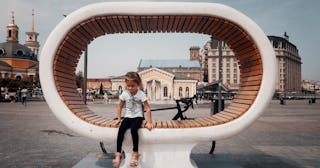 how to explain death to a child, child sitting on sculpture