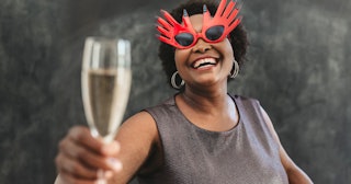 Woman celebrating NYE — funny New Year's resolutions