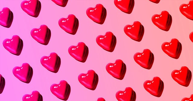 A pink-ish background with red hearts all over it representing an open letter to soulmates