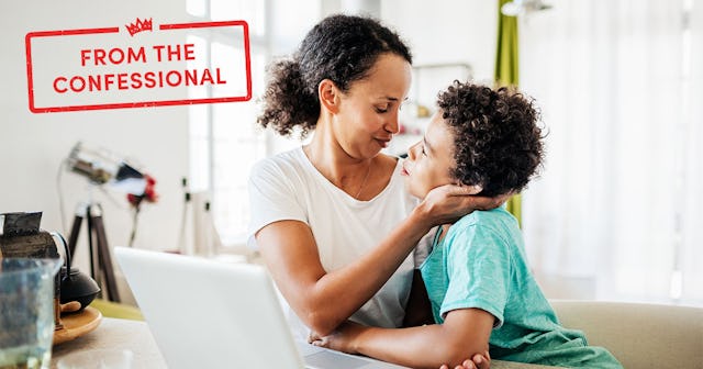 A mom being affectionate with her young son while working from home on her laptop.