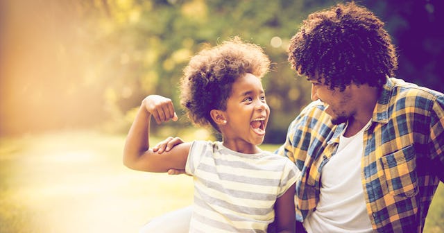 A father and a daughter laughing 