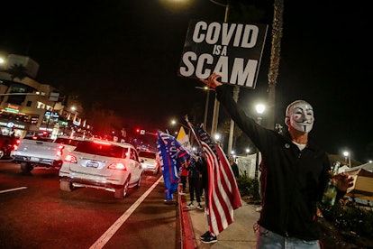 Crowds Gather In Huntington Beach To Protest COVID-19 Curfew