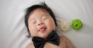 6 month sleep regression, baby sleeping with a bow tie