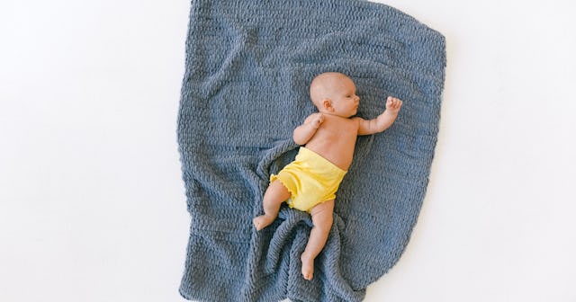 baby on blanket with tonic neck reflex