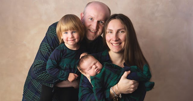 Pamela Addison, her late husband she lost during COVID-19, and their two children posing for a famil...