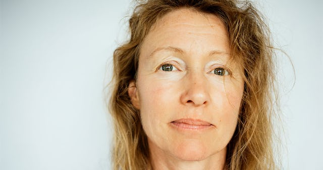 40-something-old woman with ginger hair and green eyes