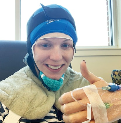 Megan Gill Carusona who is battling breast cancer, smiling in a hospital