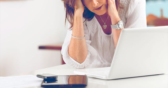 A woman with her hands on her face in distress because In-Laws have paid the price for refusing soci...