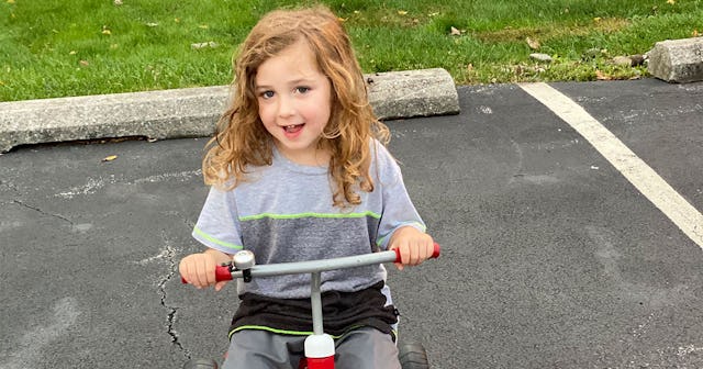 Blonde 'Nonverbal' boy on a bike