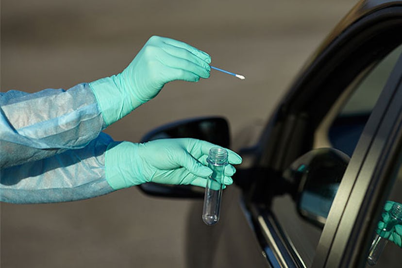 A person getting tested for Covid-19 from a car