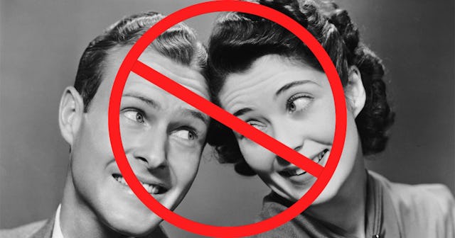 A young couple with a red prohibition sign over them