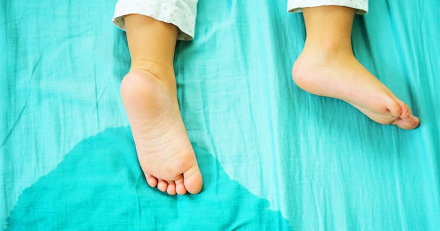 A kid sleeping while bedwetting