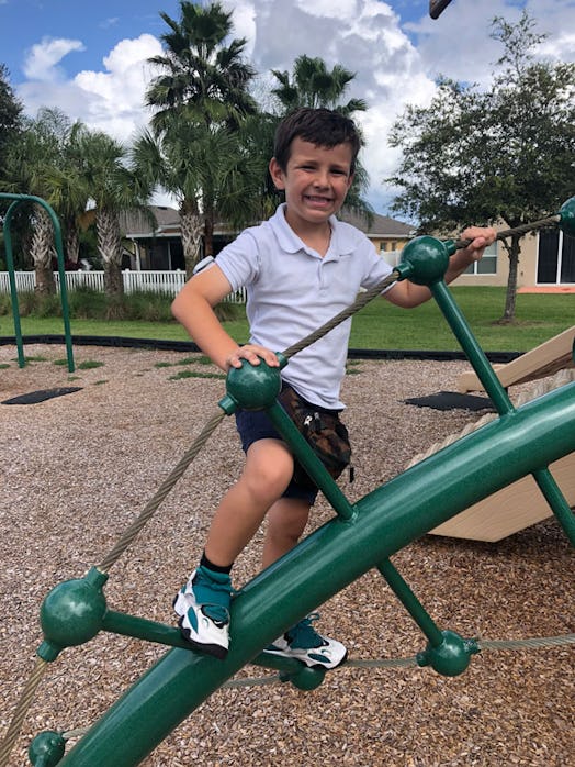 A boy with Type 1 Diabetes at the playground 