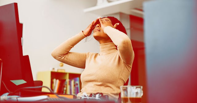 Black woman tired of being called a queen while sitting in front of the computer and working
