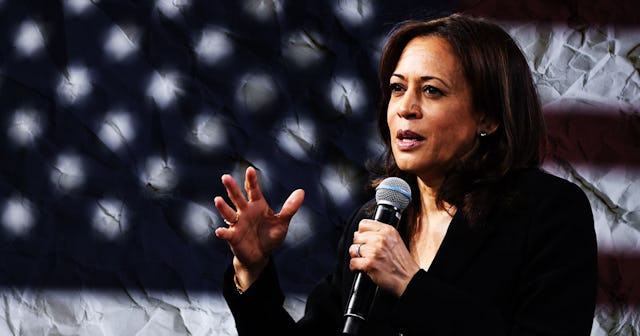 Kamala Harris having a speech with microphone in her hands and an American flag behind her.