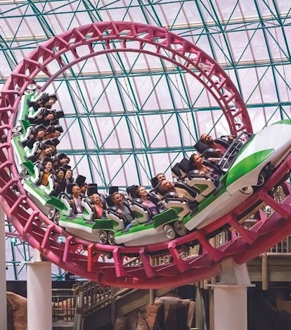 people riding on indoor roller coaster at the Adventuredome in las vegas