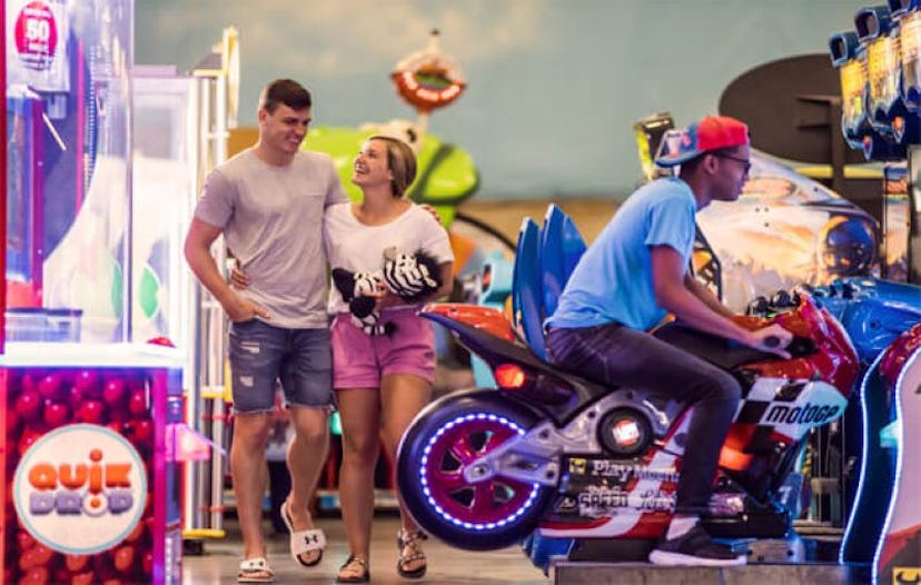 people in arcade rides at indoor theme park at mt. olympus