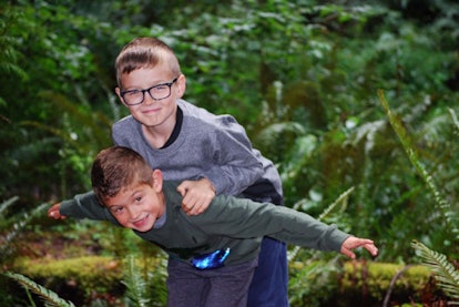 Christina Moog's sons on a camping trip smiling 