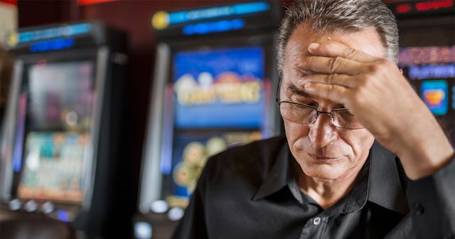 A desperate man gambling in a casino