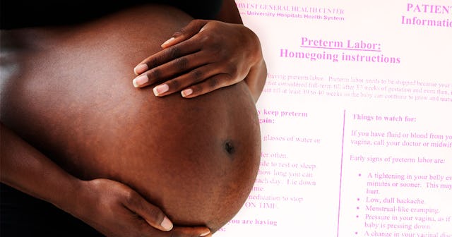 A woman holding her belly during pregnancy