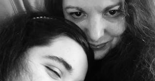 A mother and a daughter in a black and white selfie