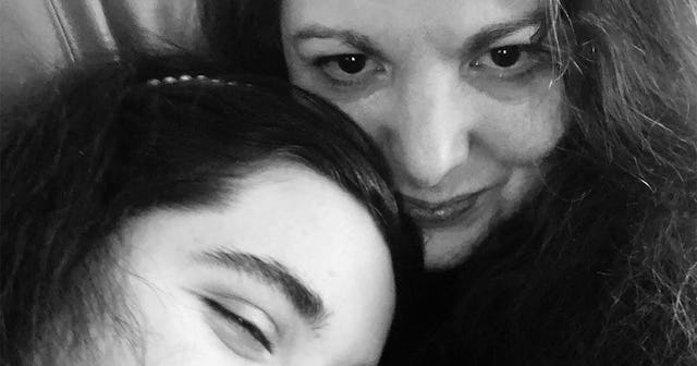 A mother and a daughter in a black and white selfie