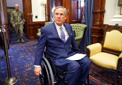 Greg Abbott heading to his office in a wheelchair
