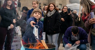 child burns mask at idaho rally.jpg