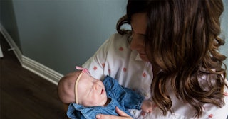 Jennifer Lendvai-Linter holding her newborn daughter that has a rare disease