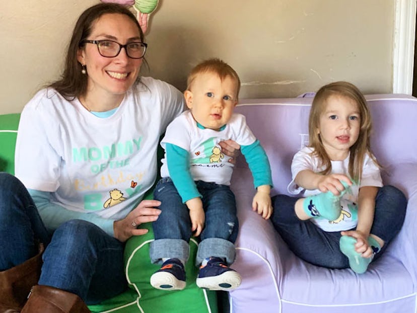 A mother and her daughter and son in matching Winnie The Pooh T-shirts 