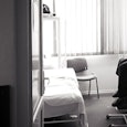 Old woman sitting in the room in hospice 