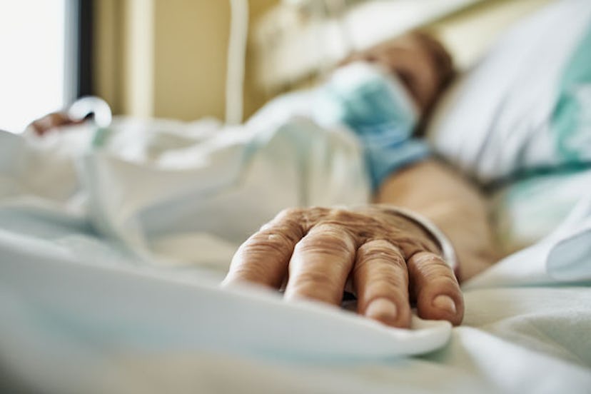 Old woman laying in hospital bed