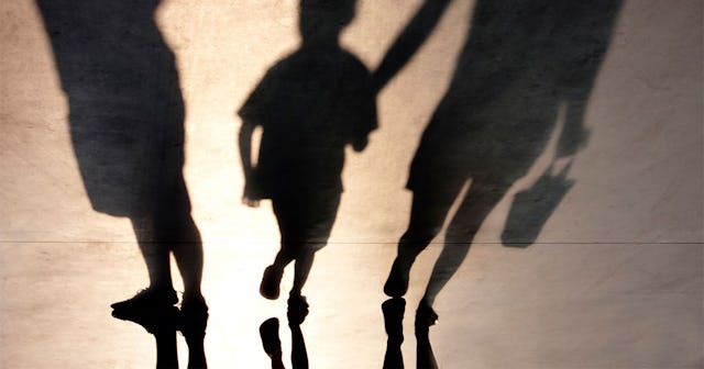 Three shadows of parents and a kid