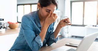 can stress make you sick, woman sitting in front of computer