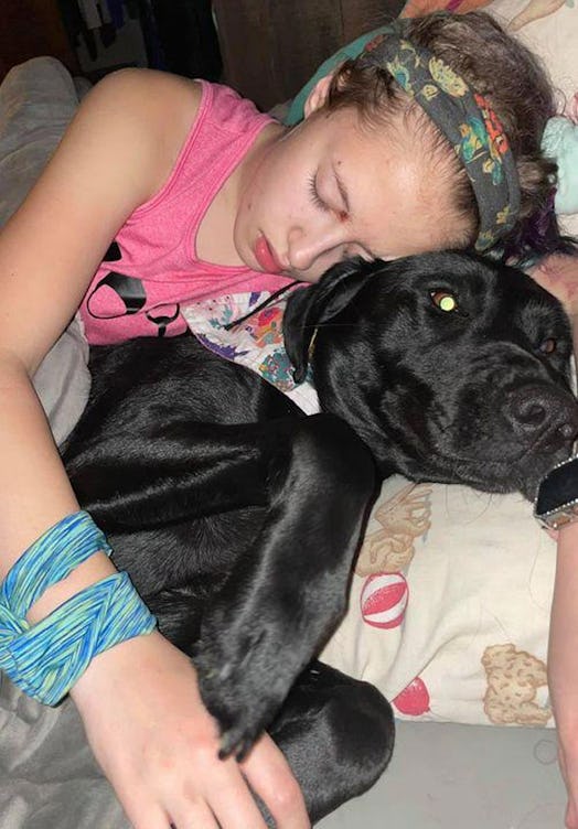 Gracie, a 14-year-old girl battling autoimmune encephalitis, and her seizure-alert dog Auggie