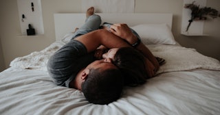 sex after hysterectomy, couple in bed embracing