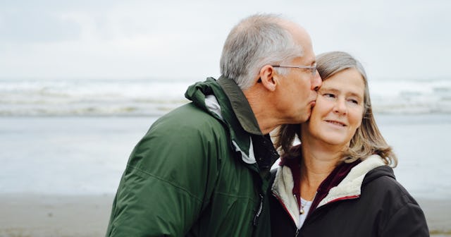 sex after hip replacement, older man kissing reluctant woman on the face