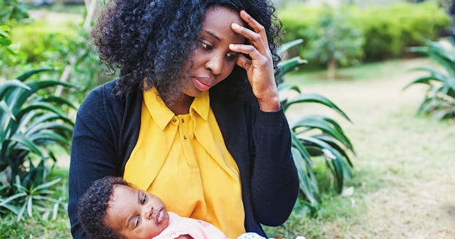 A black mom who struggles with mental health holding her son on her lap who takes care of her mental...