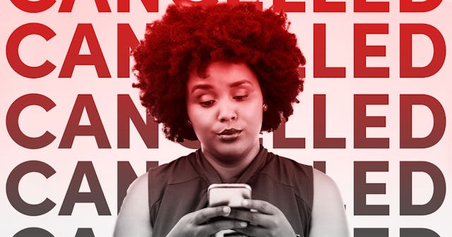 Black woman scrolling through her phone in front of a background with "CANCELLED" text