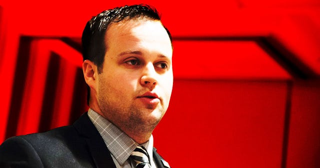 Josh Duggar wearing a grey check shirt and a black suit before being arrested