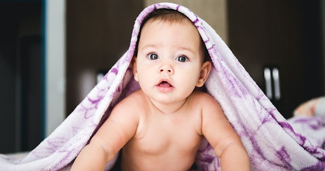 elegant girl names, baby with towel over head