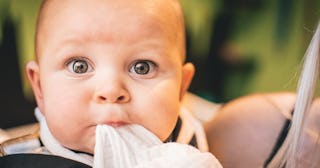 baby cough, baby's face with blanket in mouth