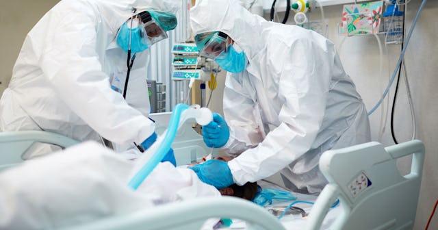 Doctors saving a COVID patient in an operating room